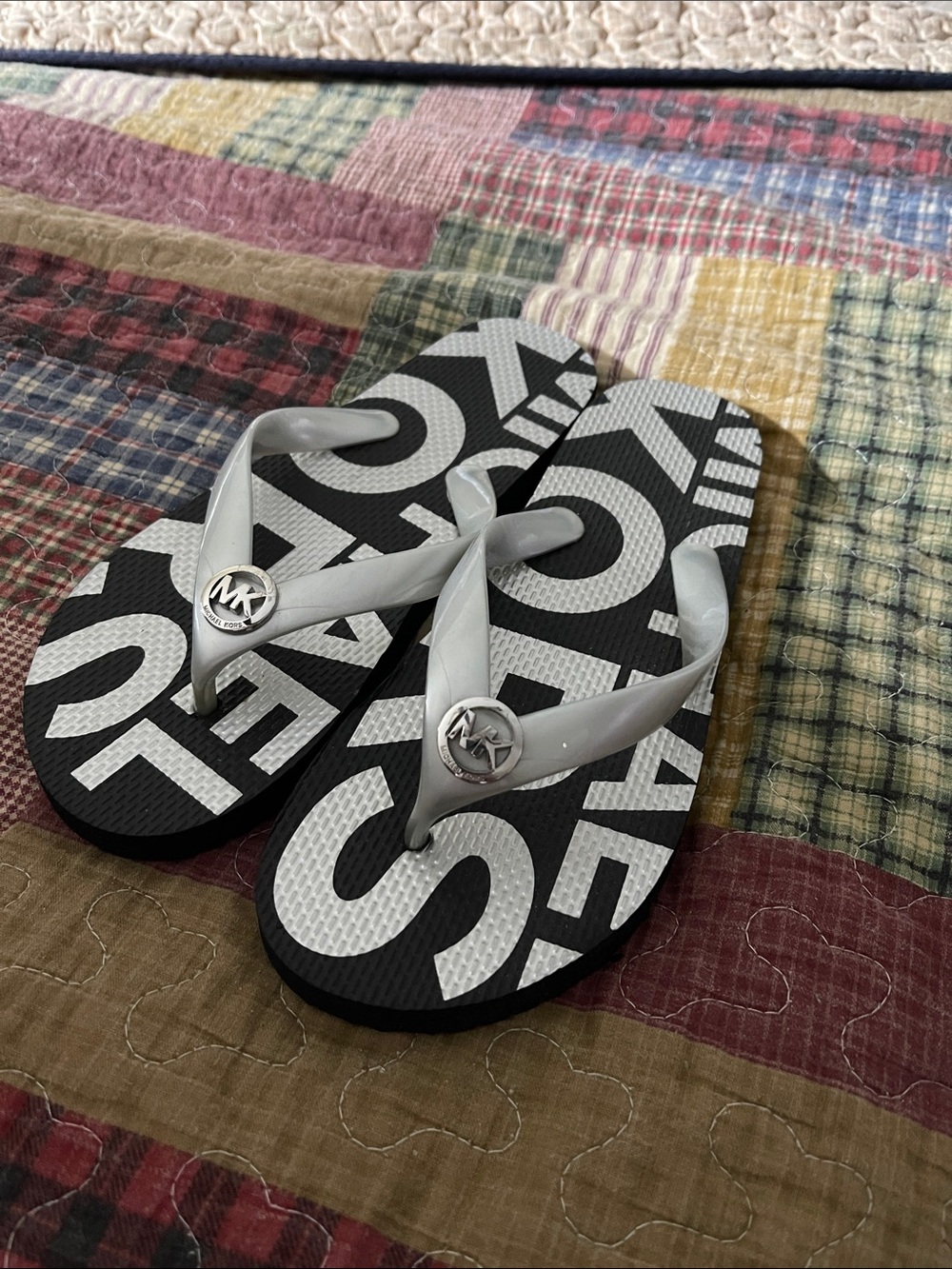 Michael Kors Black & Silver Logo Flip Flops with MK Emblem